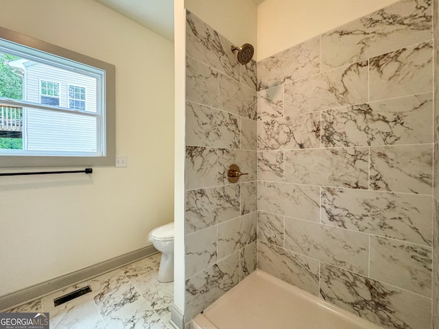 169 View St, Clarkesville, GA 30523 - full bath featuring tiled shower, toilet, marble look tile flooring, and baseboards