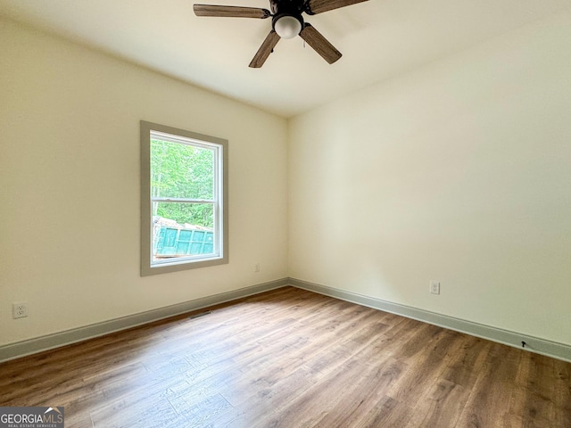 169 View St, Clarkesville, GA 30523 - empty room with wood finished floors, ceiling fan, and baseboards