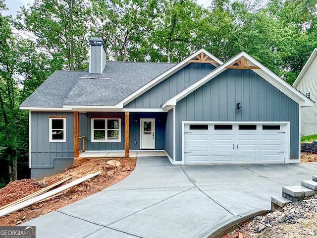 169 View St, Clarkesville, GA 30523 - ranch-style house featuring roof with shingles, concrete driveway, an attached garage, board and batten siding, and a porch