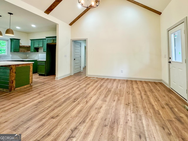 169 View St, Clarkesville, GA 30523 - kitchen with green cabinetry, high vaulted ceiling, light wood-style floors, beamed ceiling, and decorative backsplash