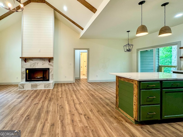169 View St, Clarkesville, GA 30523 - kitchen with green cabinetry, light wood-style flooring, baseboards, open floor plan, and beam ceiling