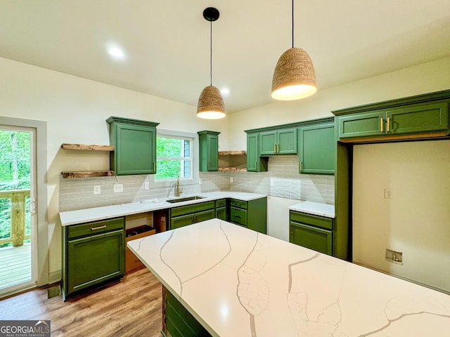 169 View St, Clarkesville, GA 30523 - kitchen featuring green cabinetry, open shelves, a sink, and decorative backsplash