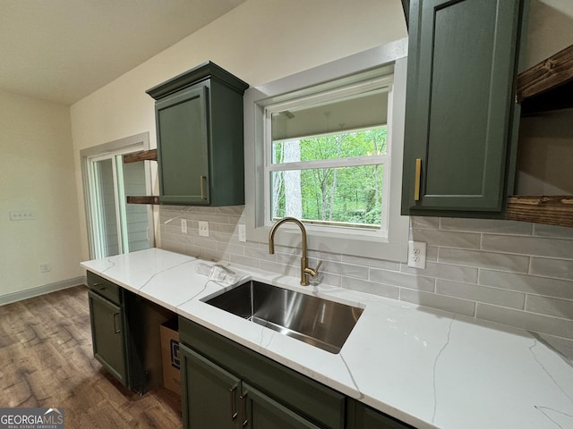 169 View St, Clarkesville, GA 30523 - kitchen with a sink, green cabinetry, decorative backsplash, light stone countertops, and dark wood-style floors