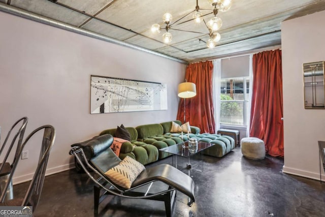 800 Peachtree St NE Unit 1014, Atlanta, GA 30308 - living room featuring concrete floors and a chandelier