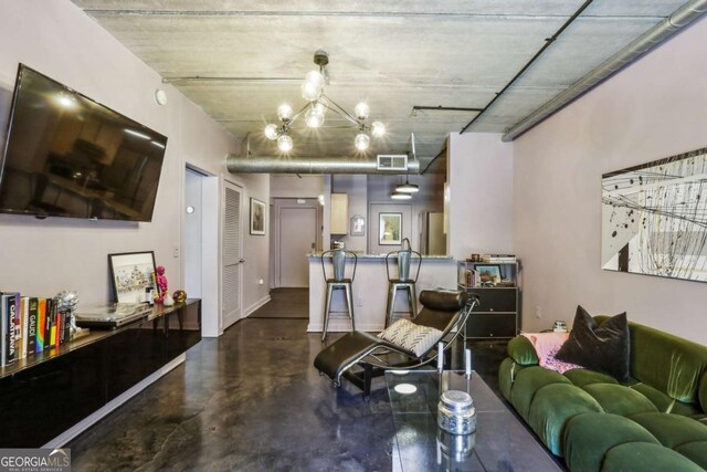 800 Peachtree St NE Unit 1014, Atlanta, GA 30308 - living area featuring concrete floors and a chandelier