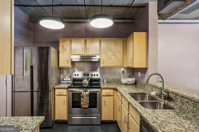 800 Peachtree St NE Unit 1014, Atlanta, GA 30308 - kitchen with stainless steel appliances, under cabinet range hood, light brown cabinetry, light stone counters, and hanging light fixtures