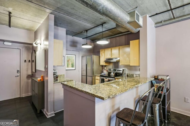 800 Peachtree St NE Unit 1014, Atlanta, GA 30308 - kitchen with appliances with stainless steel finishes, light brown cabinets, under cabinet range hood, a peninsula, and light stone countertops