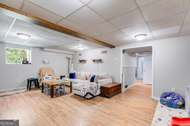 2575 Dobbs Dr NW, Kennesaw, GA 30152 - living room featuring a paneled ceiling, light wood finished floors, and baseboards