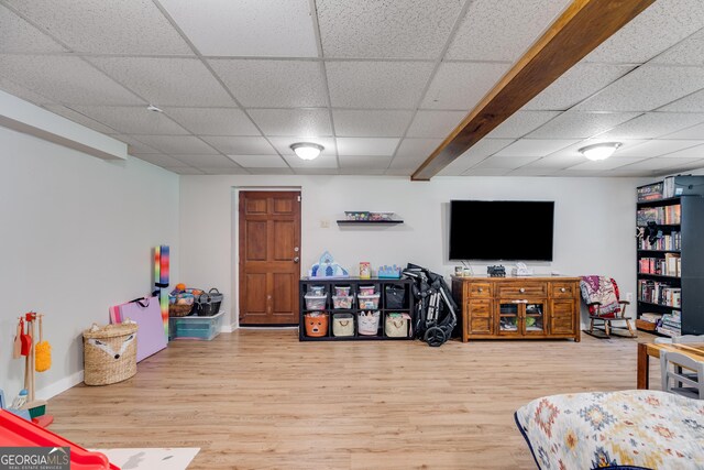 2575 Dobbs Dr NW, Kennesaw, GA 30152 - living area with a drop ceiling, baseboards, and wood finished floors