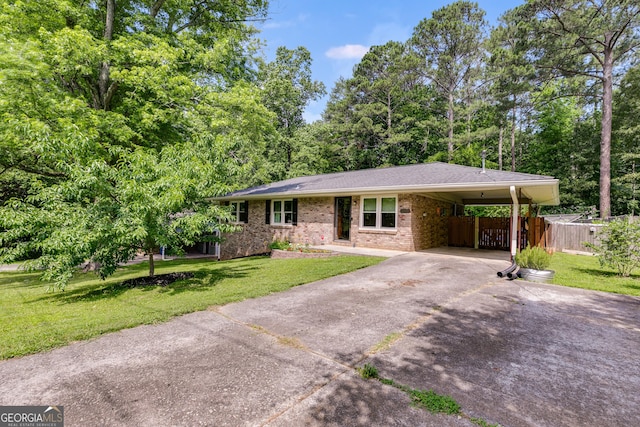 2575 Dobbs Dr NW, Kennesaw, GA 30152 - ranch-style home with driveway, brick siding, and a carport