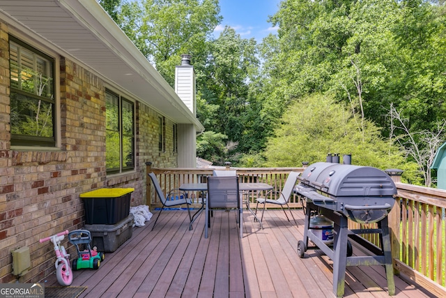 2575 Dobbs Dr NW, Kennesaw, GA 30152 - deck featuring outdoor dining space and area for grilling