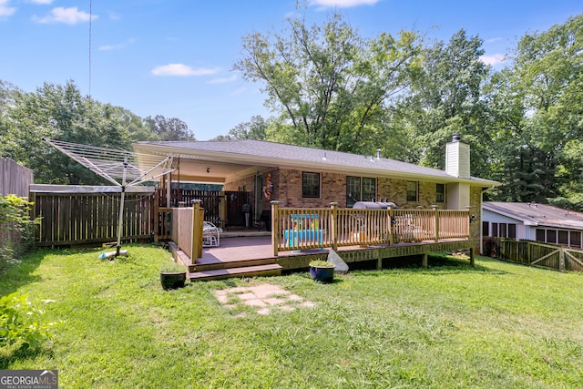 2575 Dobbs Dr NW, Kennesaw, GA 30152 - rear view of house featuring a chimney, a wooden deck, and brick siding