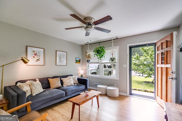 2575 Dobbs Dr NW, Kennesaw, GA 30152 - living area with wood finished floors, a ceiling fan, and baseboards