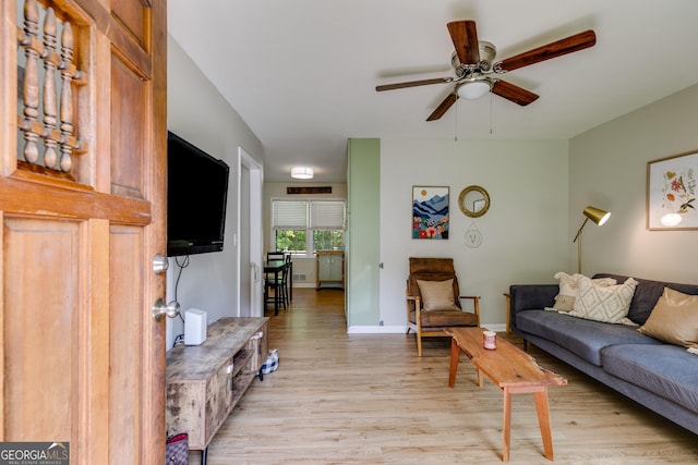 2575 Dobbs Dr NW, Kennesaw, GA 30152 - living area with light wood-type flooring, a ceiling fan, and baseboards