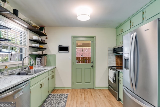 2575 Dobbs Dr NW, Kennesaw, GA 30152 - kitchen featuring stainless steel appliances, a sink, light wood finished floors, open shelves, and plenty of natural light
