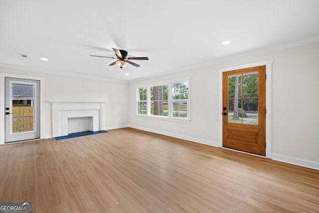 1905 Azalea, Valdosta, GA 31602 - unfurnished living room with a ceiling fan, baseboards, ornamental molding, light wood-style flooring, and healthy amount of natural light