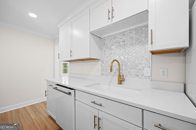 1905 Azalea, Valdosta, GA 31602 - kitchen with a sink, dishwasher, crown molding, backsplash, and white cabinetry