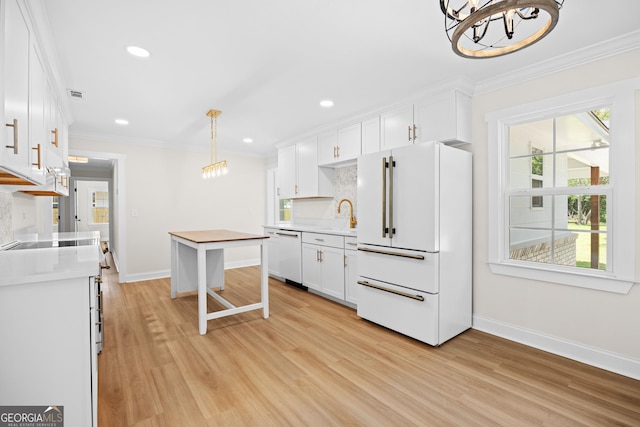 1905 Azalea, Valdosta, GA 31602 - kitchen with white appliances, a chandelier, baseboards, light wood-style floors, and crown molding