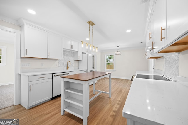 1905 Azalea, Valdosta, GA 31602 - kitchen featuring white appliances, tasteful backsplash, crown molding, light wood-style floors, and baseboards