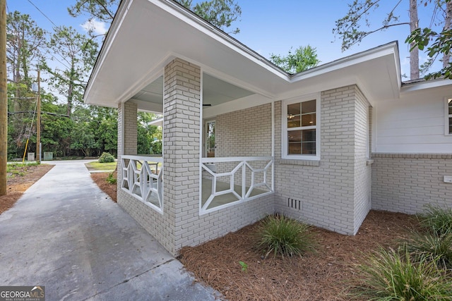 1905 Azalea, Valdosta, GA 31602 - view of side of home with brick siding, a porch, and driveway