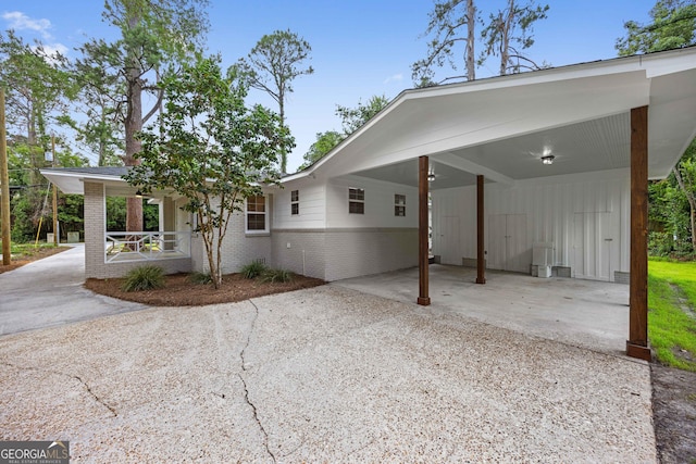 1905 Azalea, Valdosta, GA 31602 - view of front facade with brick siding, driveway, a porch, a carport, and board and batten siding
