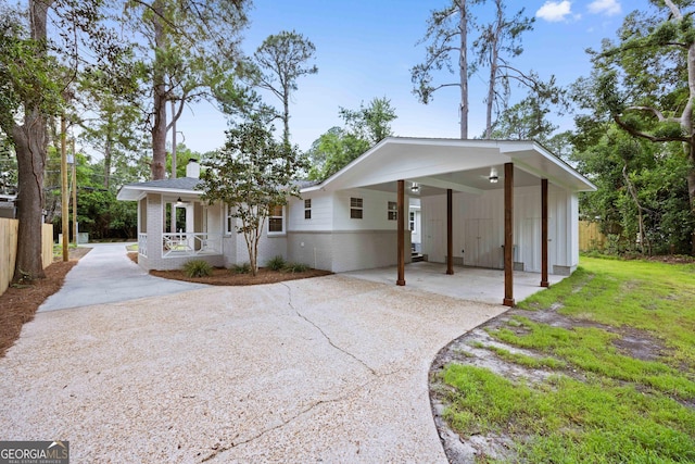 1905 Azalea, Valdosta, GA 31602 - view of front facade featuring driveway, brick siding, an attached carport, and a porch