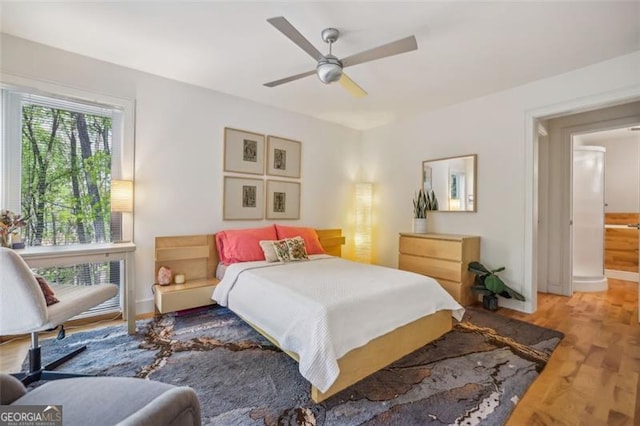 6550 Bluewaters Dr, Flowery Branch, GA 30542 - bedroom featuring a ceiling fan and baseboards