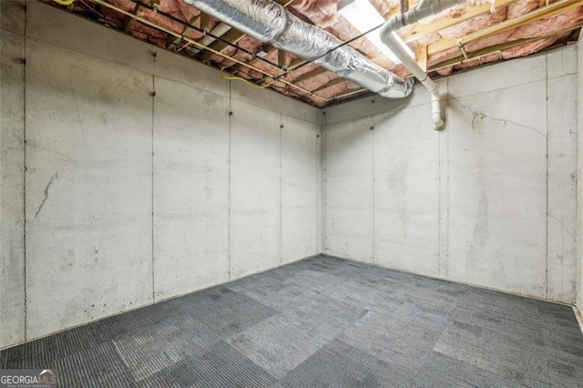 6550 Bluewaters Dr, Flowery Branch, GA 30542 - unfinished below grade area with carpet flooring