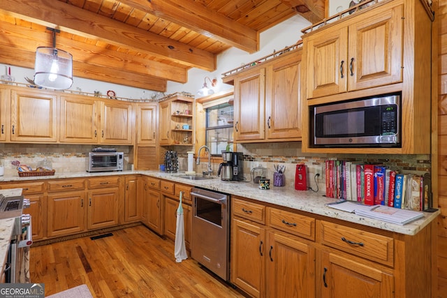 3382 Antioch Greggs Rd, Adel, GA 31620 - kitchen featuring appliances with stainless steel finishes, a sink, wooden ceiling with exposed beams, backsplash, and light wood-style flooring