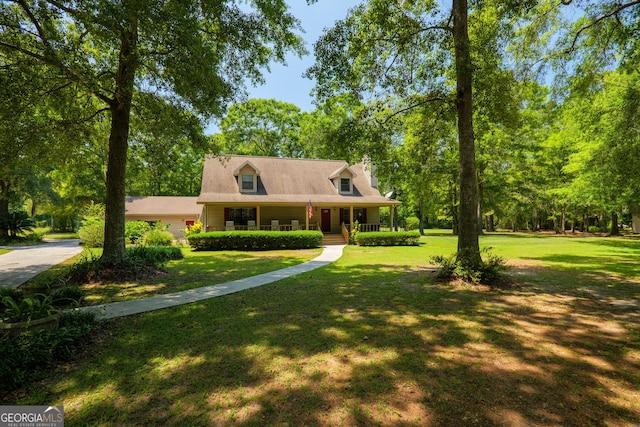3382 Antioch Greggs Rd, Adel, GA 31620 - cape cod home featuring a porch, a front yard, and view of wooded area