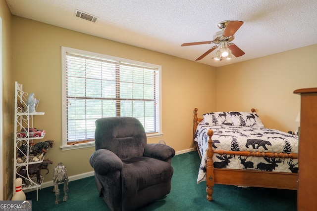 3382 Antioch Greggs Rd, Adel, GA 31620 - bedroom with carpet floors, baseboards, a textured ceiling, and ceiling fan