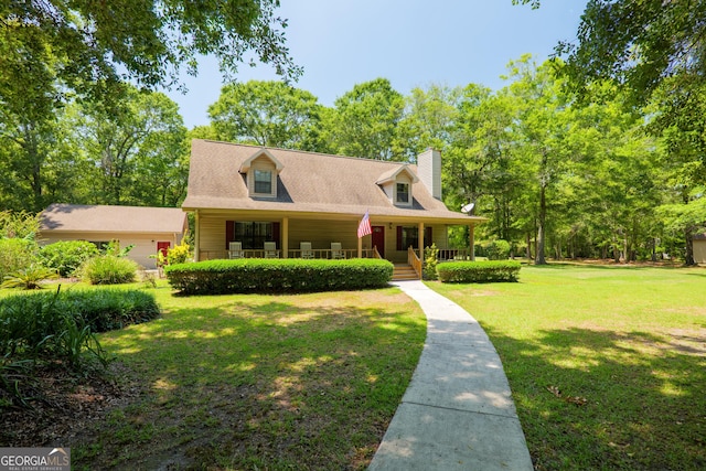 3382 Antioch Greggs Rd, Adel, GA 31620 - new england style home with covered porch, a chimney, and a front lawn