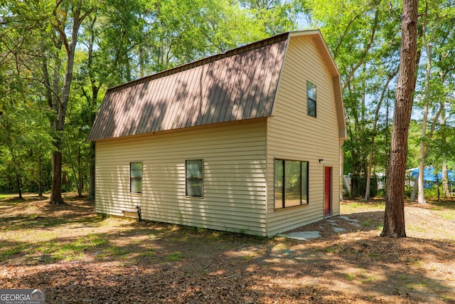 3382 Antioch Greggs Rd, Adel, GA 31620 - view of property exterior featuring a gambrel roof and metal roof