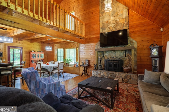 3382 Antioch Greggs Rd, Adel, GA 31620 - living area with wooden walls, wood finished floors, wooden ceiling, high vaulted ceiling, and a fireplace