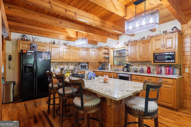 3382 Antioch Greggs Rd, Adel, GA 31620 - kitchen featuring stainless steel appliances, wood ceiling with exposed beams, light wood-type flooring, tasteful backsplash, and a kitchen island