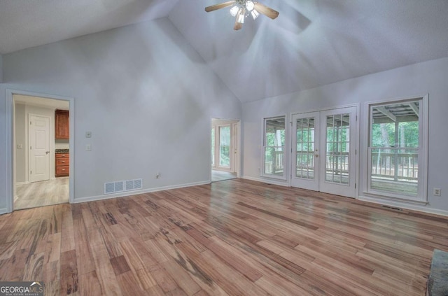 23 Timberlake Pointe NE, Cartersville, GA 30121 - unfurnished living room featuring high vaulted ceiling, ceiling fan, light wood-style floors, french doors, and baseboards