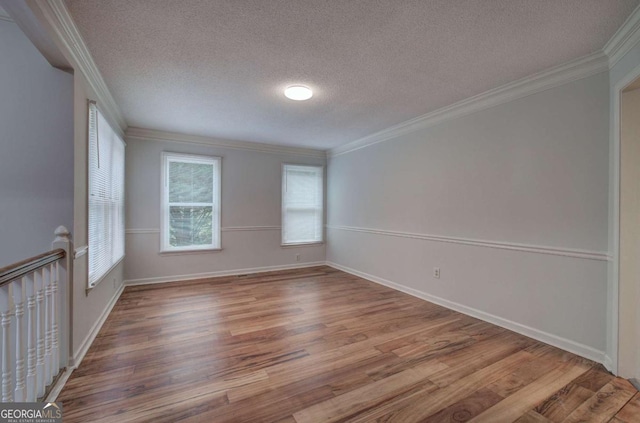 23 Timberlake Pointe NE, Cartersville, GA 30121 - empty room with wood finished floors, a textured ceiling, crown molding, and baseboards