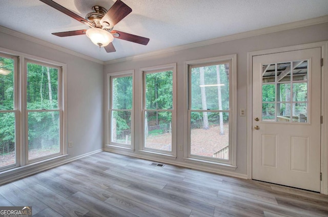 23 Timberlake Pointe NE, Cartersville, GA 30121 - entryway featuring ornamental molding, plenty of natural light, wood finished floors, a ceiling fan, and a textured ceiling