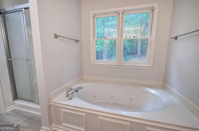 23 Timberlake Pointe NE, Cartersville, GA 30121 - bathroom featuring healthy amount of natural light, a shower stall, and a tub with jets