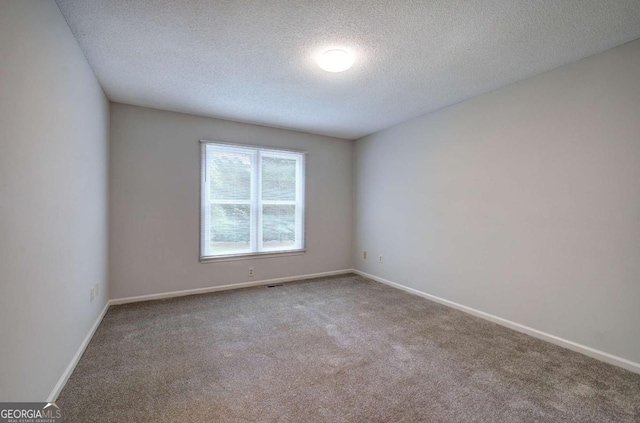 23 Timberlake Pointe NE, Cartersville, GA 30121 - carpeted spare room with a textured ceiling and baseboards