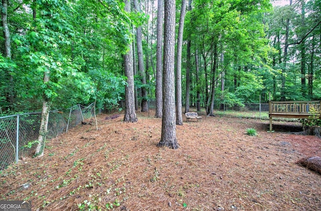 23 Timberlake Pointe NE, Cartersville, GA 30121 - view of yard featuring a deck and a wooded view