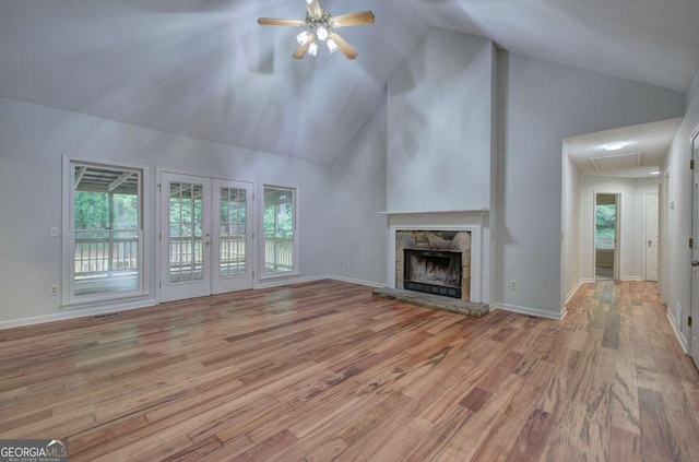23 Timberlake Pointe NE, Cartersville, GA 30121 - unfurnished living room with a ceiling fan, wood finished floors, attic access, high vaulted ceiling, and a stone fireplace
