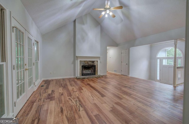 23 Timberlake Pointe NE, Cartersville, GA 30121 - unfurnished living room with ceiling fan, a fireplace, wood finished floors, and high vaulted ceiling