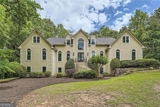 5940 Plantation Dr, Roswell, GA 30075 - view of front of house featuring stucco siding and a front lawn