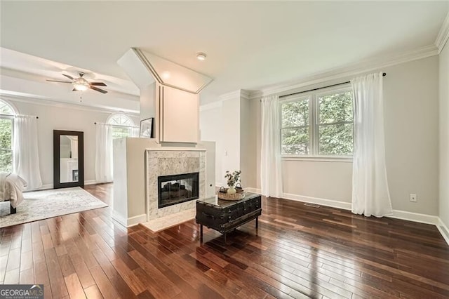 5940 Plantation Dr, Roswell, GA 30075 - living room with healthy amount of natural light, dark wood-style floors, ornamental molding, ceiling fan, and baseboards
