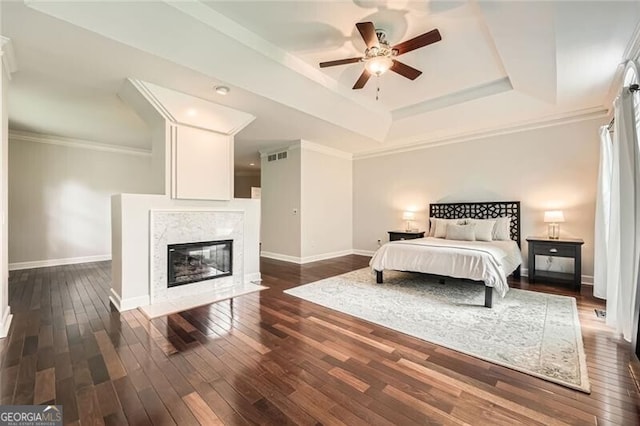 5940 Plantation Dr, Roswell, GA 30075 - bedroom featuring baseboards, dark wood-style flooring, a raised ceiling, and crown molding