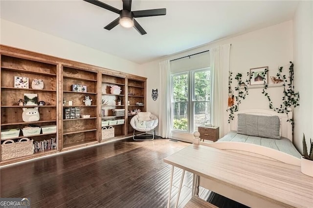 5940 Plantation Dr, Roswell, GA 30075 - sitting room with dark wood finished floors and a ceiling fan
