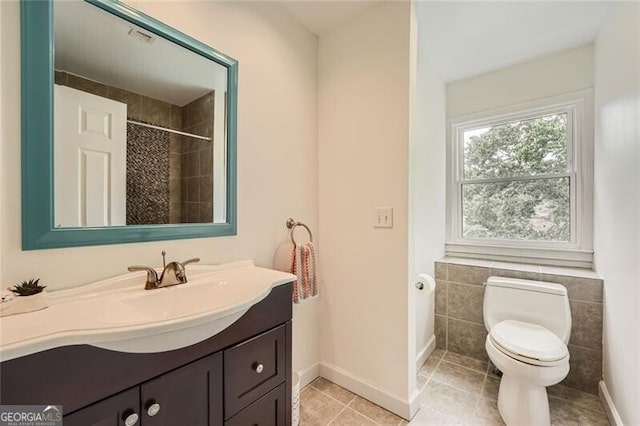 5940 Plantation Dr, Roswell, GA 30075 - full bathroom with vanity, toilet, tile patterned flooring, and a shower