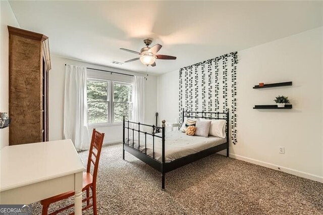 5940 Plantation Dr, Roswell, GA 30075 - carpeted bedroom featuring baseboards and a ceiling fan