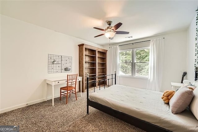 5940 Plantation Dr, Roswell, GA 30075 - carpeted bedroom with baseboards and a ceiling fan